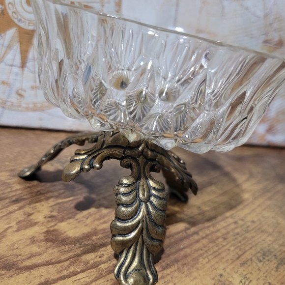 Vintage Italian glass candy dish with ornate brass legs. - Picture 1 of 6